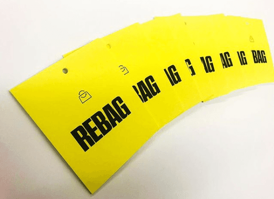 Rebag tags printed in 2 color single sided on 130# superfine ultra white and hole punched