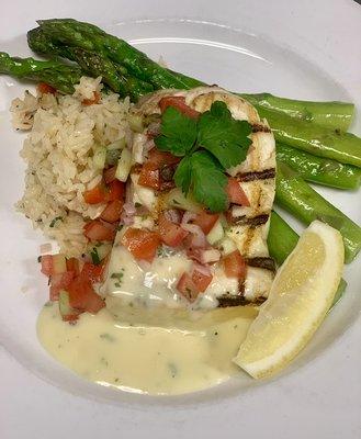 Fresh Catch Special! Grilled Halibut with Mediterranean Salsa and Beurre Blanc. Topped with a Roasted Red Pepper Basamati Rice and Asparagus