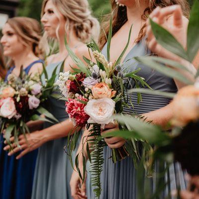 Bridal bouquet with garden roses, spray roses, Hypericum, and dried flowers