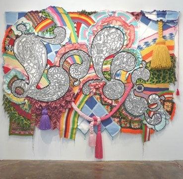 Miyoshi Barosh's "LOVE", made of recycled afghans. Barosh is the 1st artist in residence at the New Children's Museum in S.D.