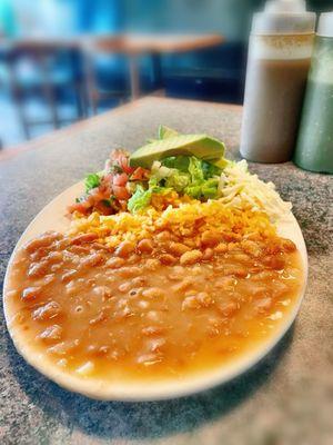 Rice, beans, lettuce, avocado, pico de gallo and cheese. Comes with the Fajitas Plate.