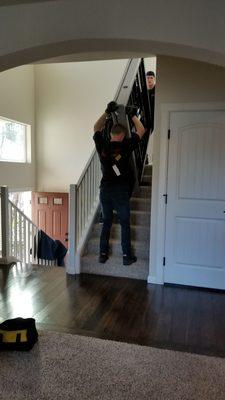 The guys moving out our extremely heavy adjustable bed through multiple flights of steps!