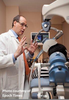 Dr. Manevitz explaining TMS therapy