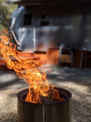 Fire pit with provided wood