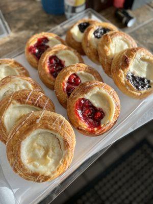 Delicious and fresh danishes: cream cheese, cherry and blackberry.