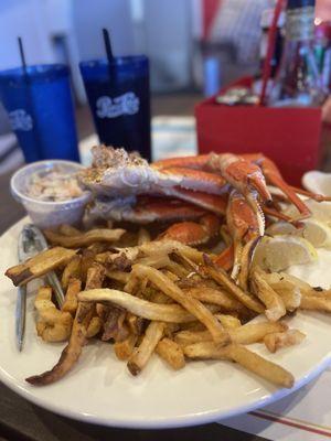 Snow crab legs, fries and cole slaw.