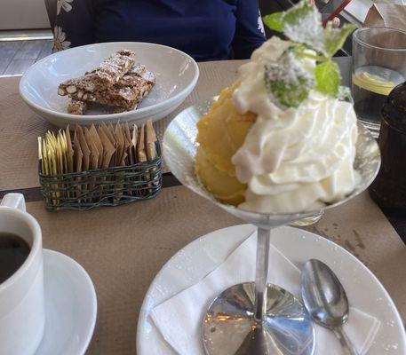 Mango sorbet with fresh mint and whipped cream and in the background is Il Forno's delicious biscotti.