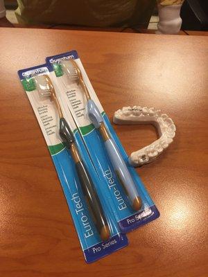 Night guard and toothbrushes