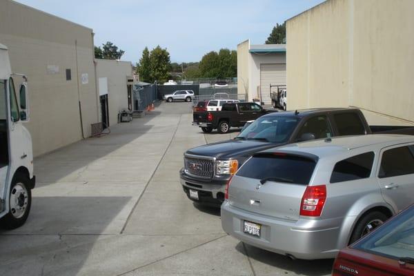 Driveway to Express Towing car lot on the right side of the Napa Auto Parts building.