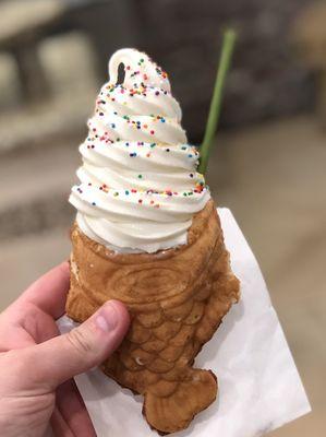 Organic milk cone with rainbow sprinkles and a green tea pocky.