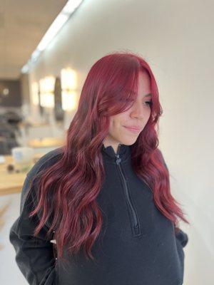 Beautiful red color with face framing layers done by Heidy