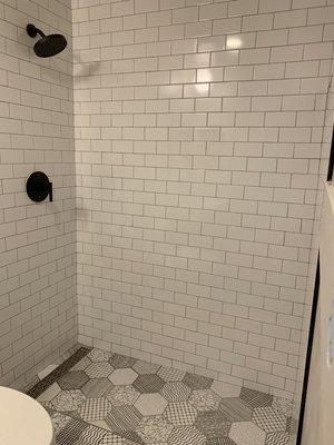 Walking subway tile and hexagon floor.