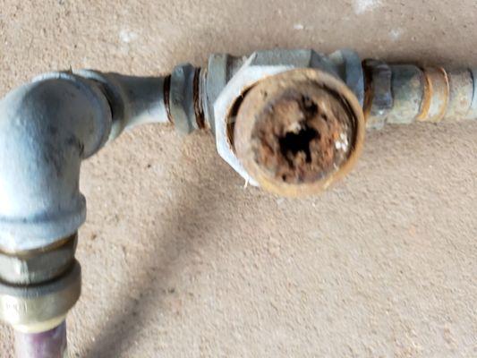 The customer called saying they had low water pressure. Did some investigating and found this plugged water union.