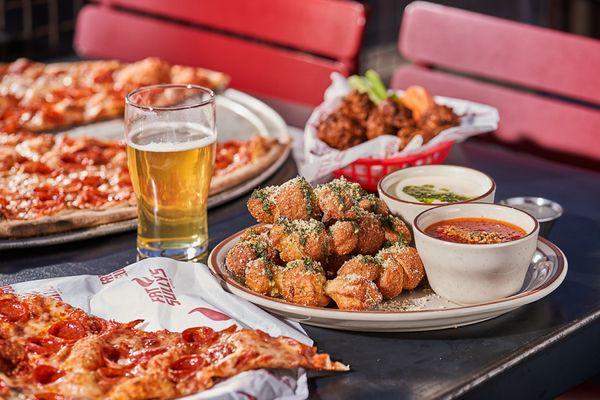 Atomic Cowboy home of Denver Biscuit Co & Fat Sully's NY Pizza, loaded garlic knots