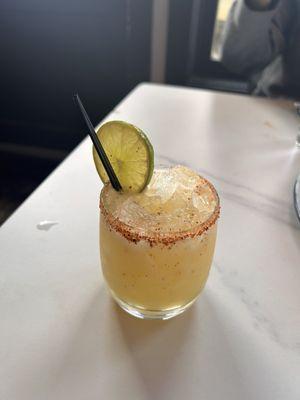 Passion fruit margarita with tajin on rim