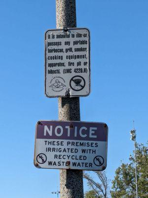 Signs on a streetlight