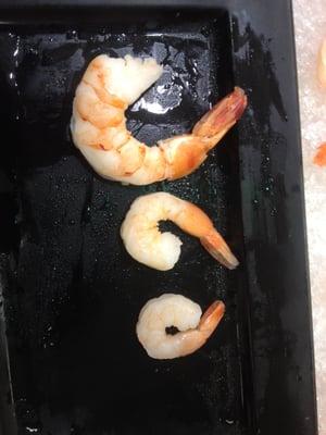 The top is a Jumbo, size 13-15. The next one is a 26-30, normally in a shrimp scampi, and the bottom is a 31-40. They served 26-30's....