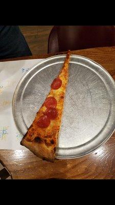 The BIG slice of pizza.  The cost for this slice $5,75
 Sam's slice is bigger.