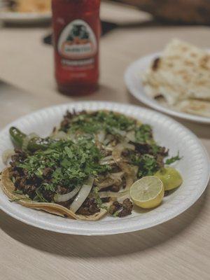 2 asada tacos with grilled onion!