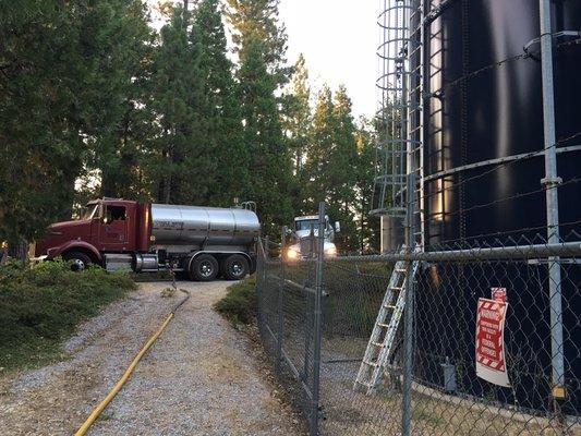 Tankers on assignment performing emergency water delivery.