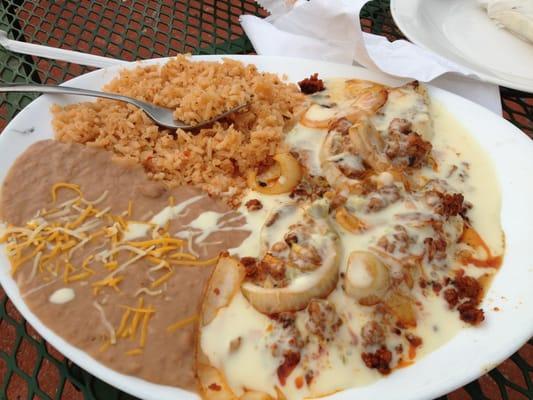 This is amazing! Churrizo and fajita chicken smothered in white sauce.