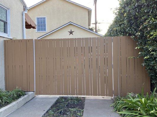 Vertical driveway gate with modern design. All steel frame with custom cedar wood installation. solid stain - mar Vista, Ca 90066