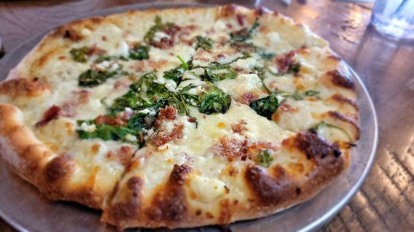 Custom personal pizza: bacon,  spinach,  and feta with white sauce