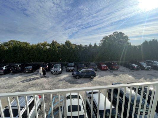 Parking lot front terrace with seating area view