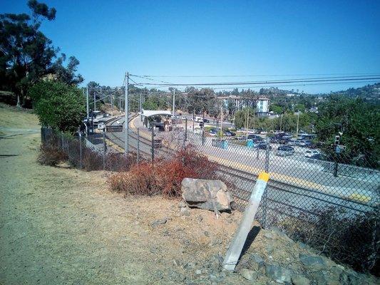 Over looking the spring Street trolley you can see the large parking lot below where you can catch the bus getting a space.