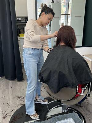 Stephanie at work on very long ,  very  heavy , thin but loads of head of hair.