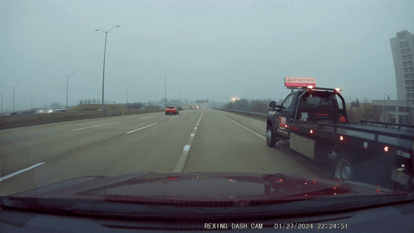 Driver aggressively passing on shoulder