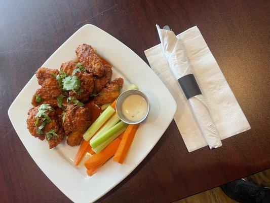 Buffalo wings served with carrots, celery and blue cheese.