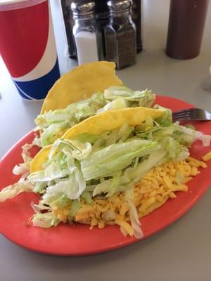 The corn shells are lightly fried like at a fair. The cheese is shredded velveeta I think. The beef isn't greasy,flavor is good.