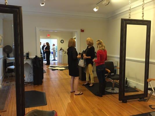 Long view of the salon with gorgeous wood floors