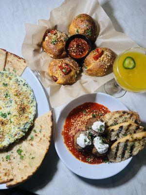 Spicy garlic knots, meatballs and artichoke dip