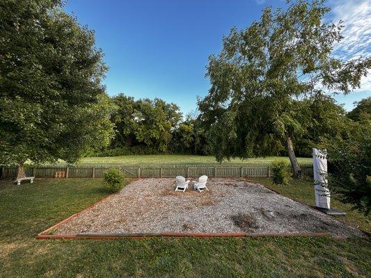 Woodchip 30x30 plot with white chairs = before.