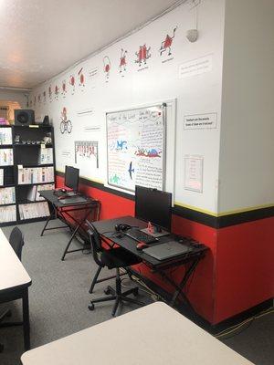 Inside the center with @home online instructor stations.