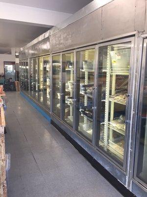 Freezer section of traditional West African food items. Stock fish, chicken, beef, goat, fish, tripe, okra, etc.