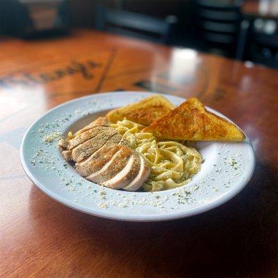 Chicken Fettuccine Alfredo - grilled chicken in a house-made alfredo sauce on fettuccine noodles. Served with garlic toast