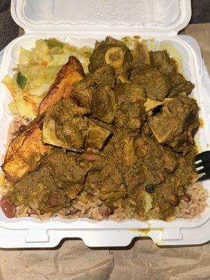 Curry Goat with cabbage and plantains.