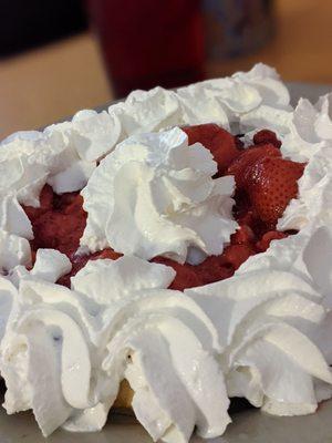 Belgian waffle with strawberries and cream