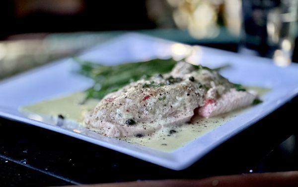 Crab -Stuffed Salmon BROILED SALMON STUFFED WITH CRAB MEAT IN A LEMON CAPER SAUCE SERVED WITH A SIDE SAUTEED GREEN BEANS.