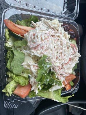 Seafood salad on top of Large Tossed Salad