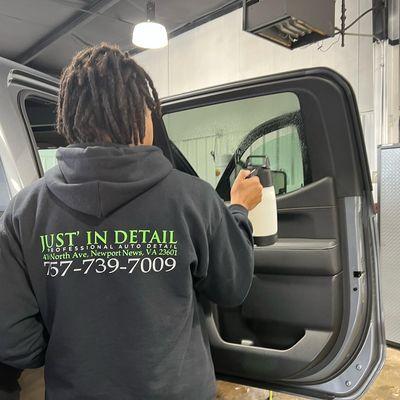 This is Jackson, he's prepping and cleaning the window so that we can install window tint.