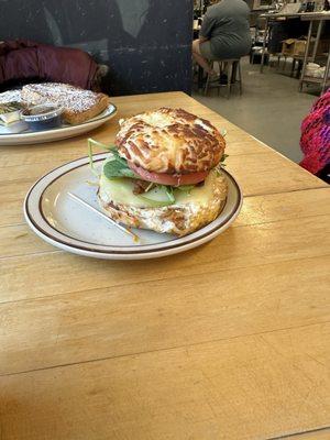 Bagel Sandwich: Asiago Bagel, American, eggs, bacon, spinach, sprouts, tomato, and Chipotle Mayo