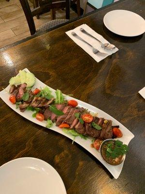 Sa-Rong-Thai, Premium angus beef grilled and sliced with Thai sauce topping on it.