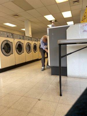 The tireless host - he cleans the machines nonstop!