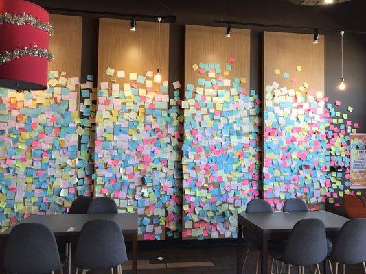 1 Wall covered with Customer Notes & a couple of Dining Tables