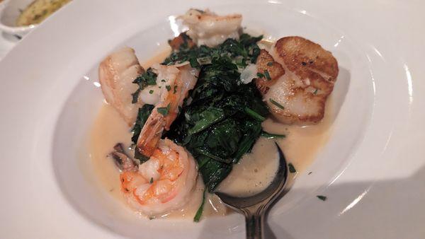 Shrimp and Scallops with sautéed spinach.