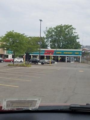 Store front, tucked along the side near the tracks